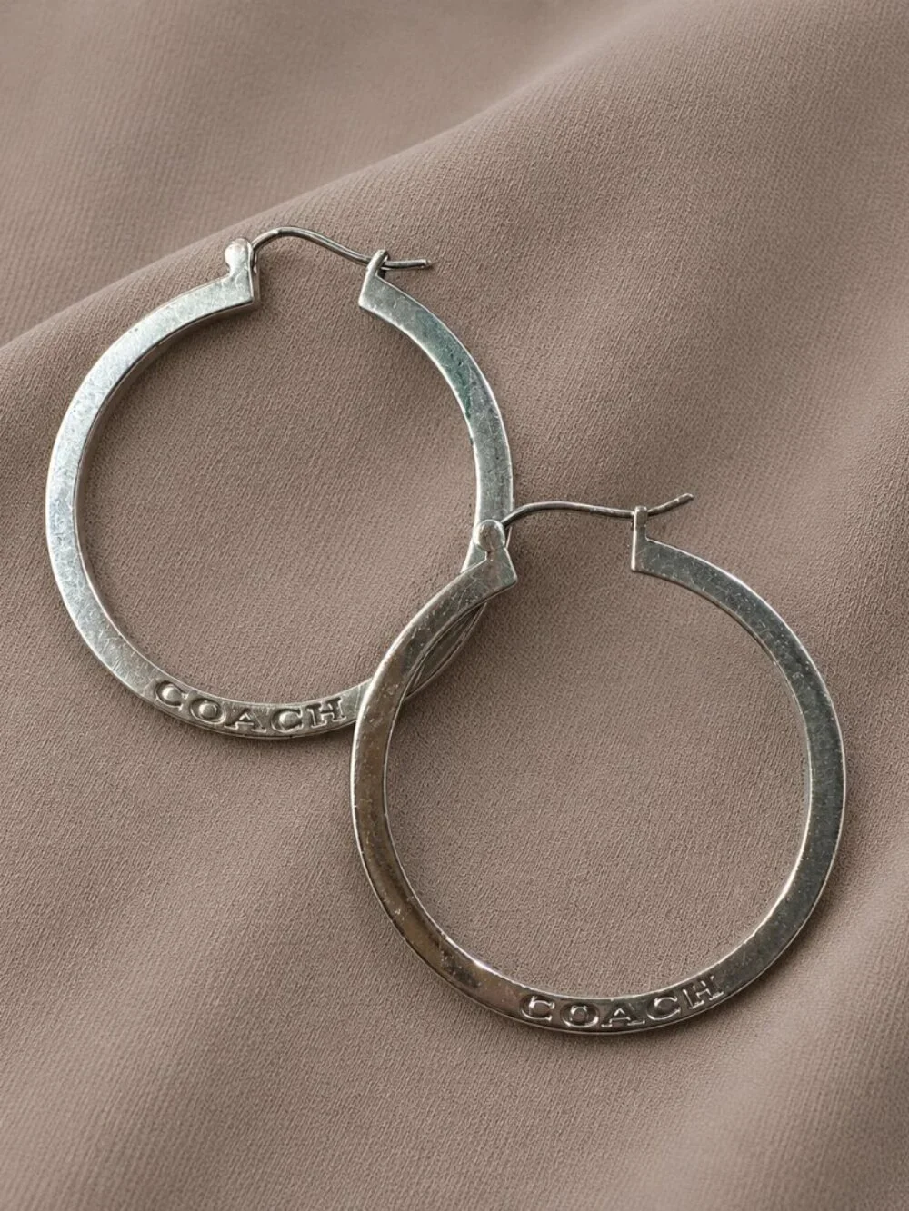 Coach Silver Tone Logo Hoop Earrings - Picture 2 of 4